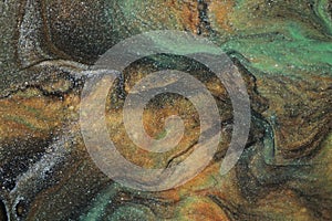 Earth tones blend together to create an abstract background that resembles an ancient cave painting.