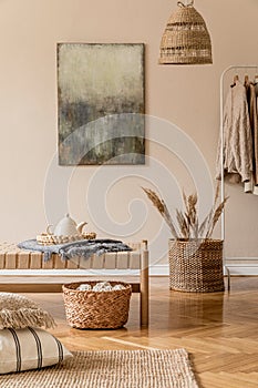 Earth tones living room interior with wooden furnitures and rattan natural decorations.