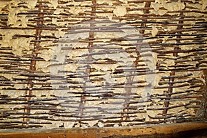 Earthen plaster hardened in wattle and daub wall, texture
