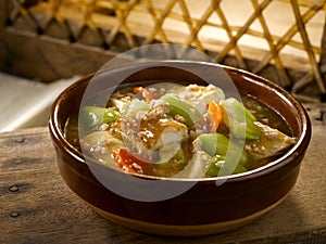 Earthern Bowl Tofu with Luffa served isolated on table side view