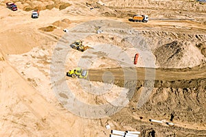 Earthmover preparing ground for future building construction. aerial photo