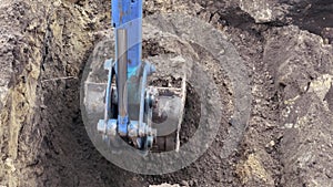 earthmoving excavator. construction a excavator digging the ground close-up. trench bulldozer construction business