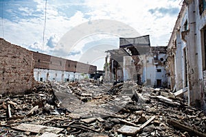 Earthquake or war aftermath or hurricane or other natural disaster, broken ruined buildings, pills of concrete garbage