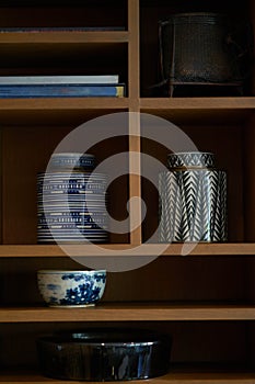 Earthware decoration on book shelf