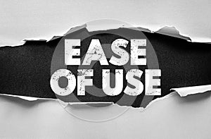 EASE OF USE phrase displayed under torn paper. Simplicity, convenience, and accessibility concept for user-friendly products,