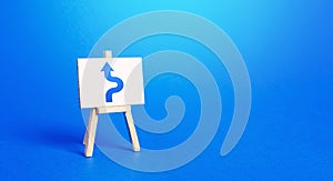 An easel with a blue arrow avoiding an obstacle. Maneuvering, taking right action. Deviation from the route, side mission.