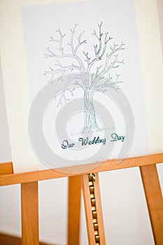 Easel with `Our wedding` day tree for quest