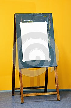 An easel and a sheet of drawing paper.