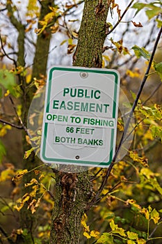 Easement sign to notify public fishing is allowed.