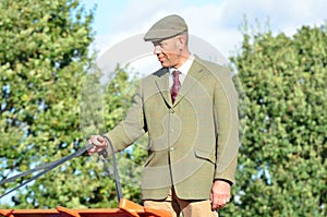 East Anglia Equestrian Fair English country gent holding reins of Carthorse