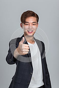 East Asian business young man you are the best. photo