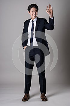 East Asian businessman shooting studio portrait photo