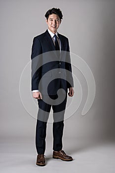 East Asian businessman shooting studio portrait photo