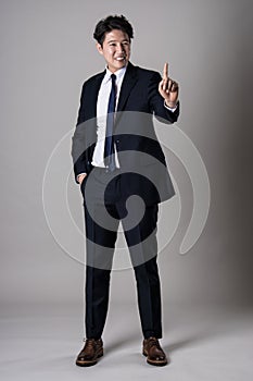 East Asian businessman shooting studio portrait photo