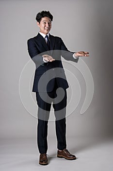 East Asian businessman shooting studio portrait photo