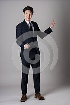 East Asian businessman shooting studio portrait photo