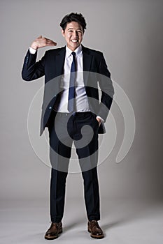 East Asian businessman shooting studio portrait photo