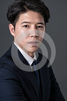 East Asian businessman shooting studio portrait photo