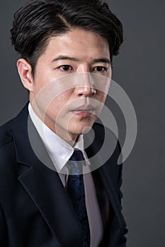 East Asian businessman shooting studio portrait photo