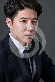 East Asian businessman shooting studio portrait photo