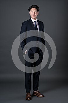 East Asian businessman shooting studio portrait photo