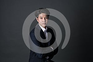 East Asian businessman shooting studio portrait photo