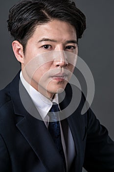 East Asian businessman shooting studio portrait photo