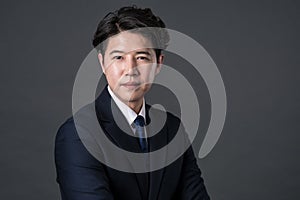 East Asian businessman shooting studio portrait photo