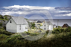 East Coast homes on rocky shoreline overlooking the Atlantic Ocean at Keels Newfoundland Canada