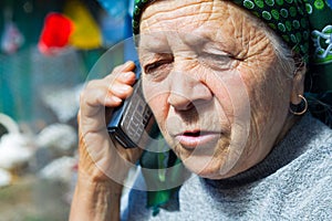 East european senior woman and mobile phone