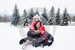 East Indian family playing in the snow