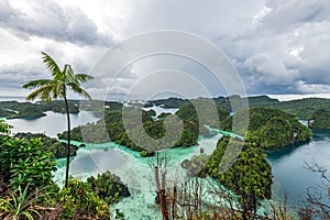 East Misool, group of small island in shallow blue lagoon water