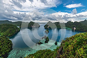 East Misool, group of small island in shallow blue lagoon water