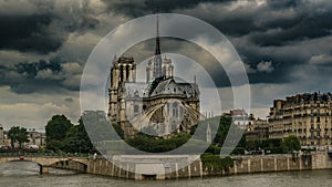 East side of Notre-Dame de Paris under dark overcast sky, gothic architecture