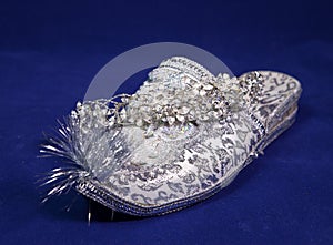 East style bride wedding shoes on a blue velvet and wedding diadem