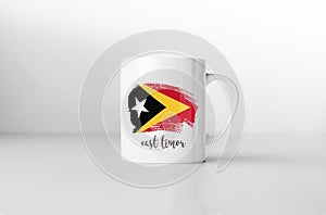 East Timor flag on white coffee mug.