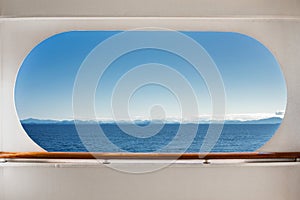 East view across Queen Charlotte Sound, BC, Canada through crusie ship window.