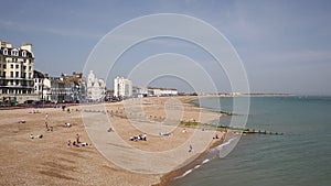 Eastbourne beach England with people enjoying the sunshine