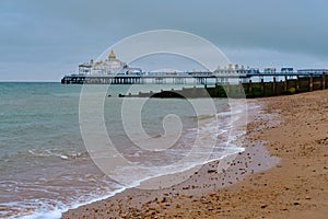 Eastbourne beach in the summer with overcast sky.