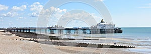 Eastbourne pier and beach, East Sussex, UK on a sunny summer day