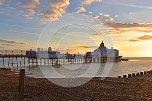 Eastbourne Pier at dawn with glorious golden sky
