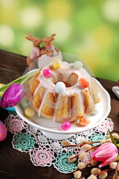 Easter almond ring cake on wooden table