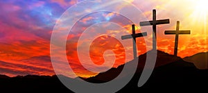 Easter background banner panorama religious greeting card Crucifixion and Resurrection. Three crosses of Golgotha by sunset