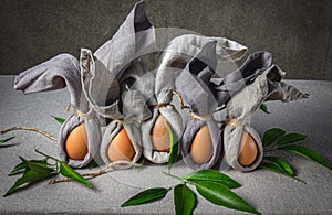 Easter background with Easter bunny made from eggs and linen napkin. Festive easter home table decoration.