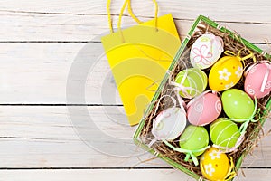 Easter background with colorful eggs and gift bag