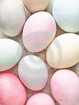 Easter background, colorful pastel dyed Easter eggs close up.