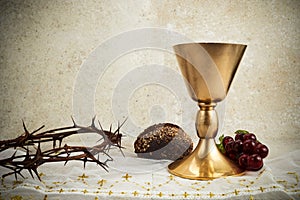 Easter background with crown of thorns and Chalice with red wine as concept for Christ blood