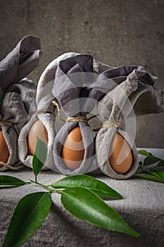 Easter background with Easter bunny made from eggs and linen napkin. Festive easter home table decorationter home table decoration