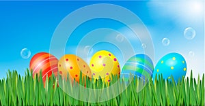 Easter background Easter eggs laying in grass