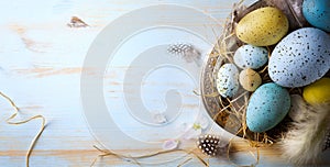 Easter background with Easter eggs and spring flowers. Top view